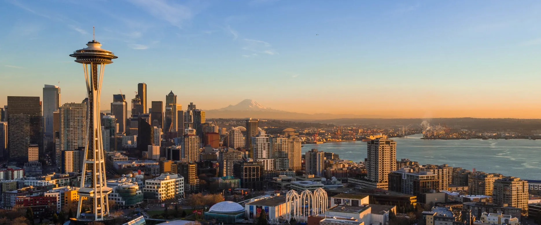 Seattle skyline with the Space Needle in the foreground and Mount Rainier in the distance