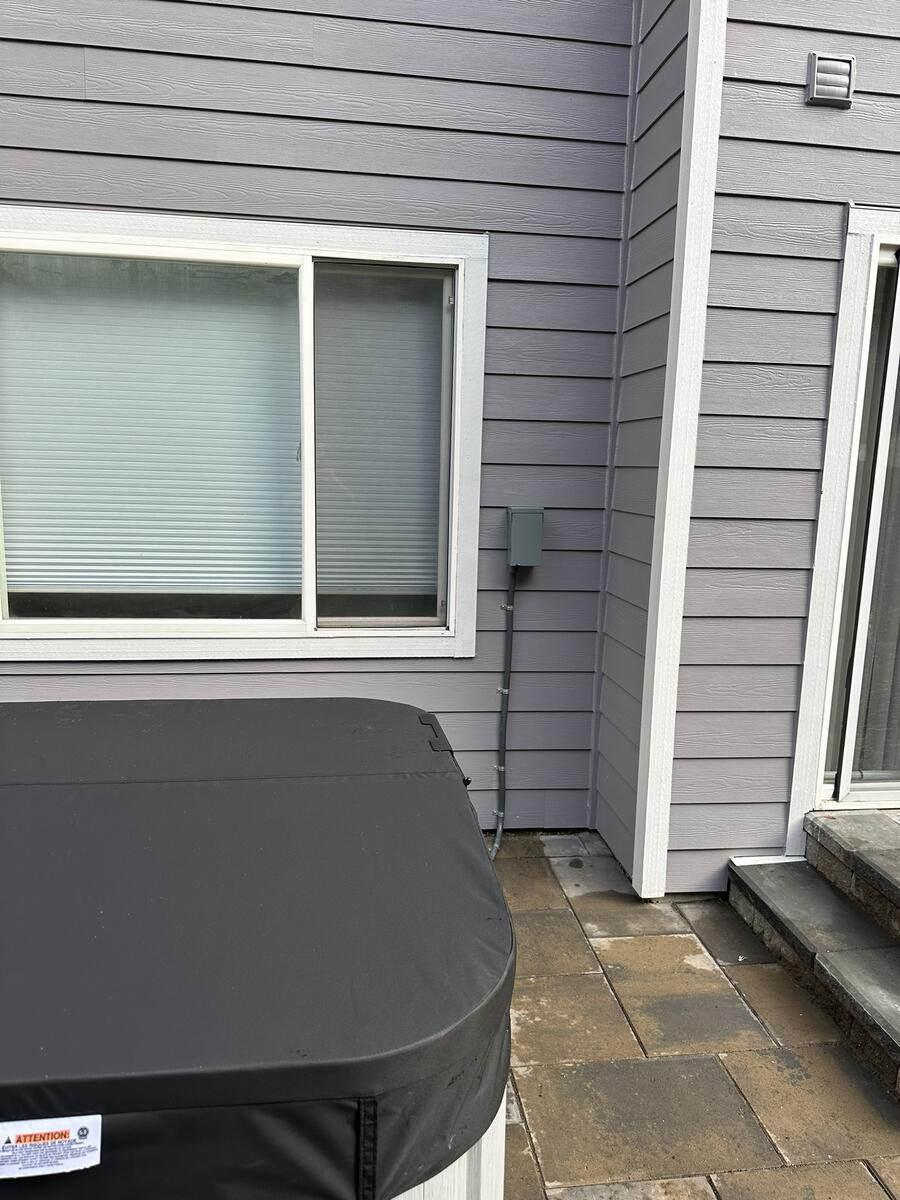Completed hot tub electrical installation with disconnect switch