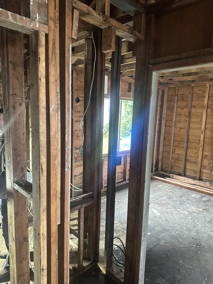 Room during rewiring with new wiring being installed